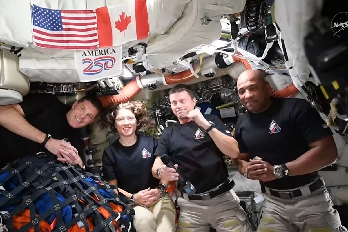 Trump beams in to speak with NASA astronauts on their spacecraft after they circle the moon and head home to Earth