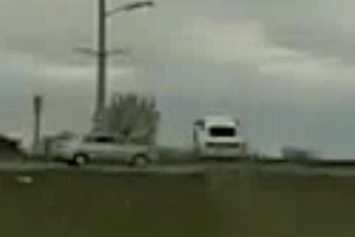 Wild moment speeding car flies over another vehicle while fleeing police