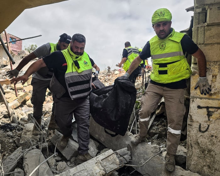 Israel fires more than 120 airstrikes at Lebanon and says it is escalating offensive
