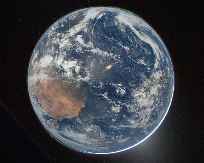 Artemis II astronauts share image of Earth as they pass halfway to the moon