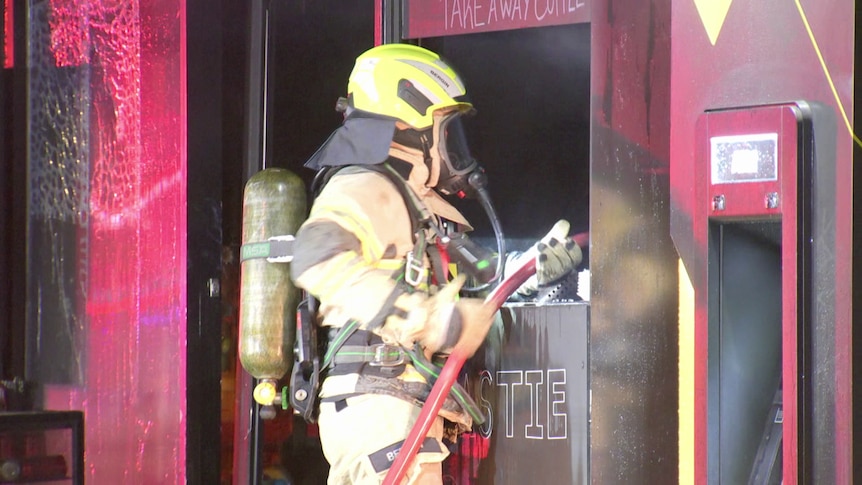 Melbourne cafe catches fire three days after alleged drive-by shooting
