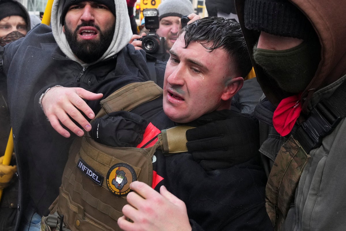 Pardoned Jan 6 rioter chased from pro-ICE rally in Minneapolis after blasting ‘Ice, Ice Baby’ and threats to burn Quran