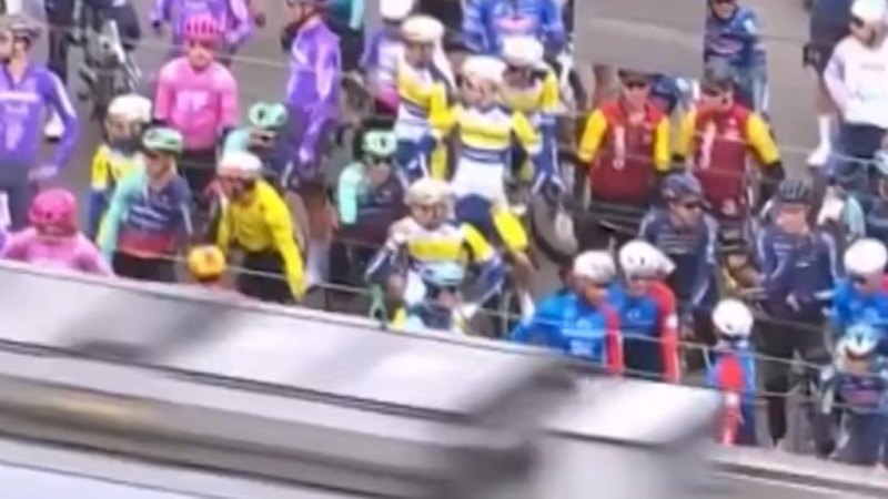 Cyclists face fine for running red light as train splits cycling field