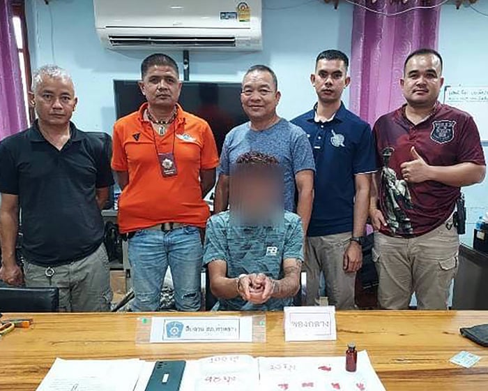 Image of Thai police in sparkly dresses with handcuffed suspect turns out to be AI fake