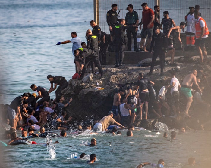 At least 18 die as 49,000 people cross to Spanish enclave of Ceuta from Morocco